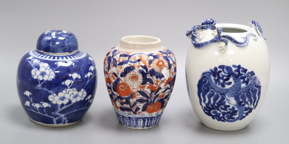 A blue and white Chinese dragon jar, an Imari jar and a blue and white lidded Prunus jar, tallest 17.5cm
